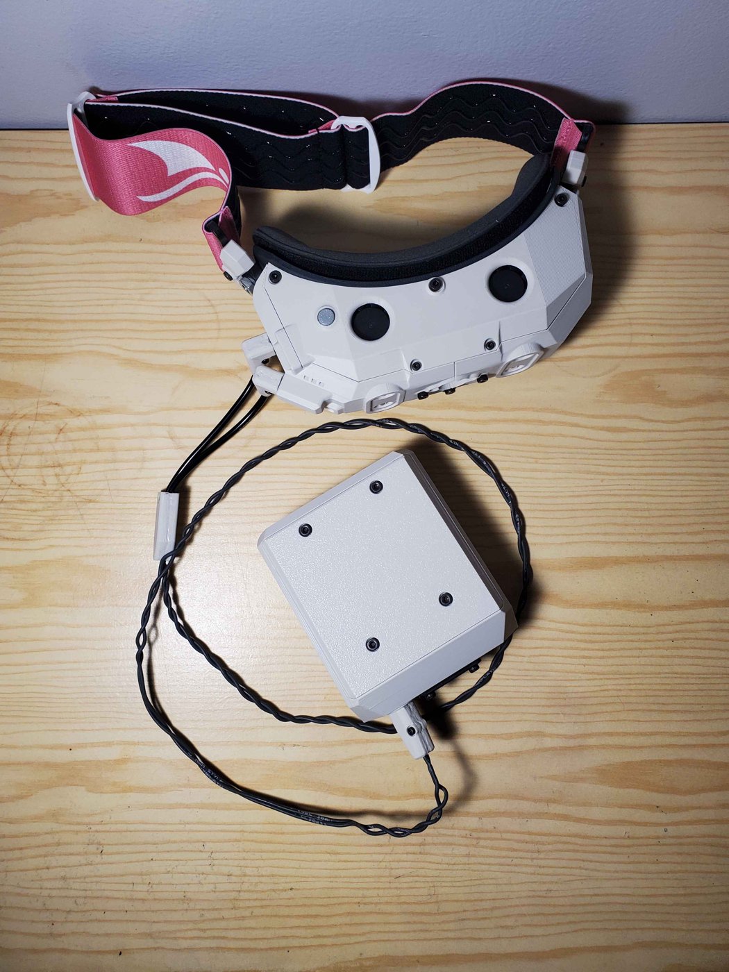 The Vision AI headset and its umbilical control box.